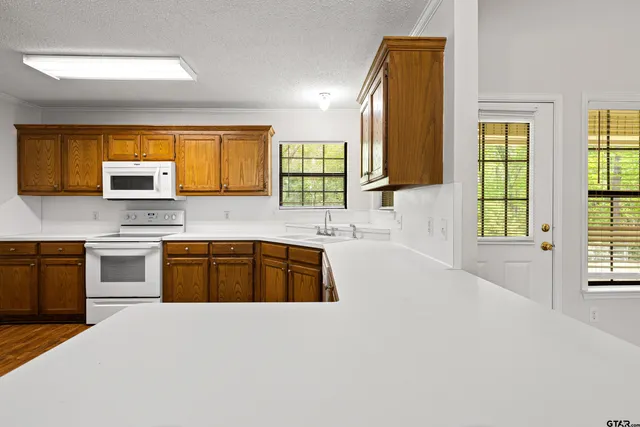a large kitchen with a window