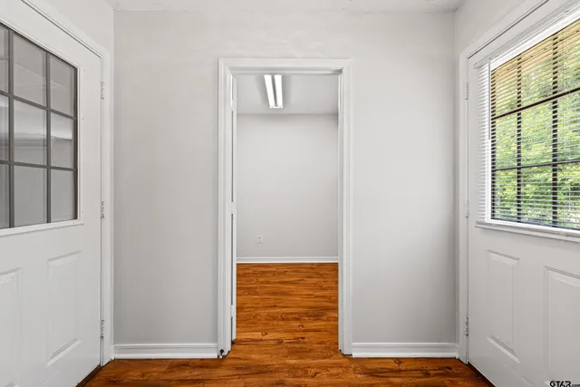 a view of walk in closet with empty room