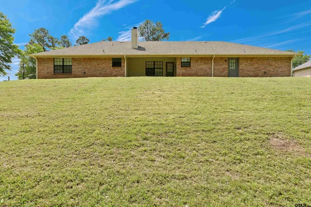 a front view of a house with yard