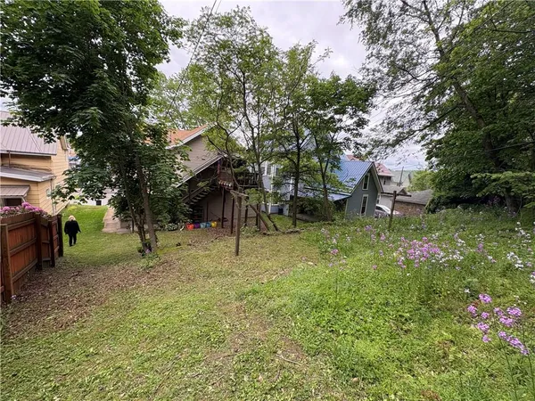 a view of a tree in front of a house