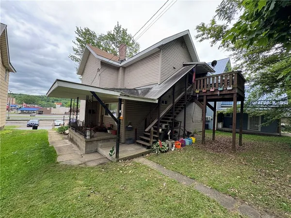 a view of a chairs and table in patio