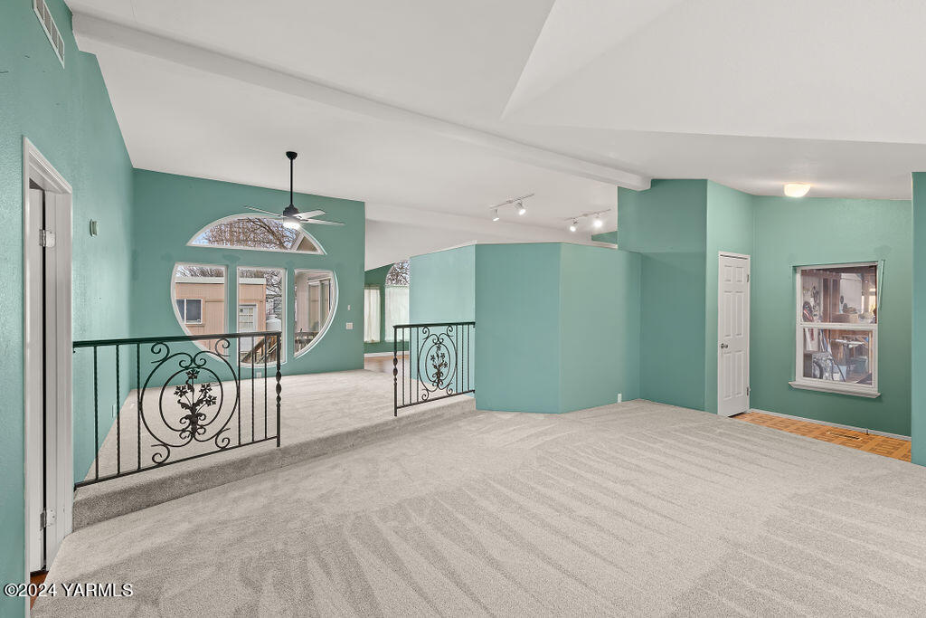 4111 Bell Road Yakima, WA 98901 - Photo 8 of 33 a big room with chandelier fan and windows