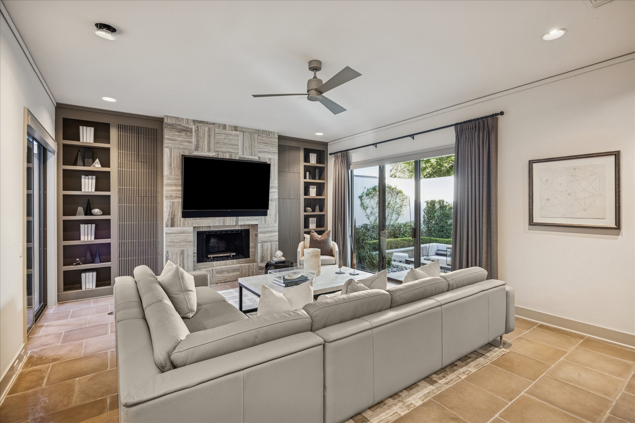 3124 Mid Lane Houston, TX 77027 - Photo 15 of 41 a living room with furniture a fireplace and a flat screen tv