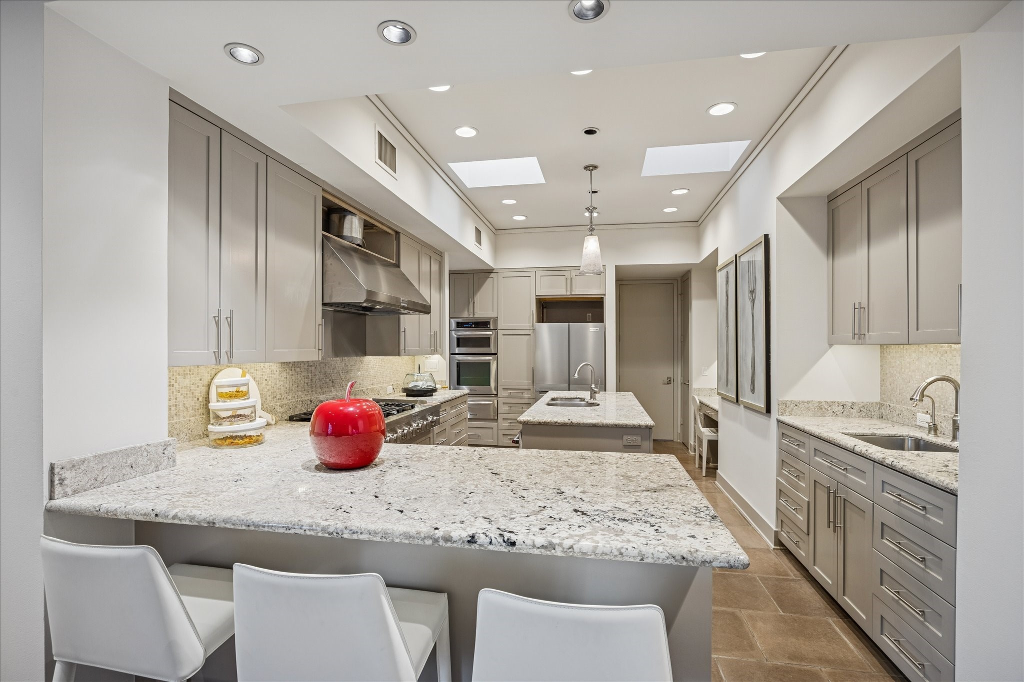 3124 Mid Lane Houston, TX 77027 - Photo 20 of 41 a kitchen with stainless steel appliances granite countertop a sink and cabinets