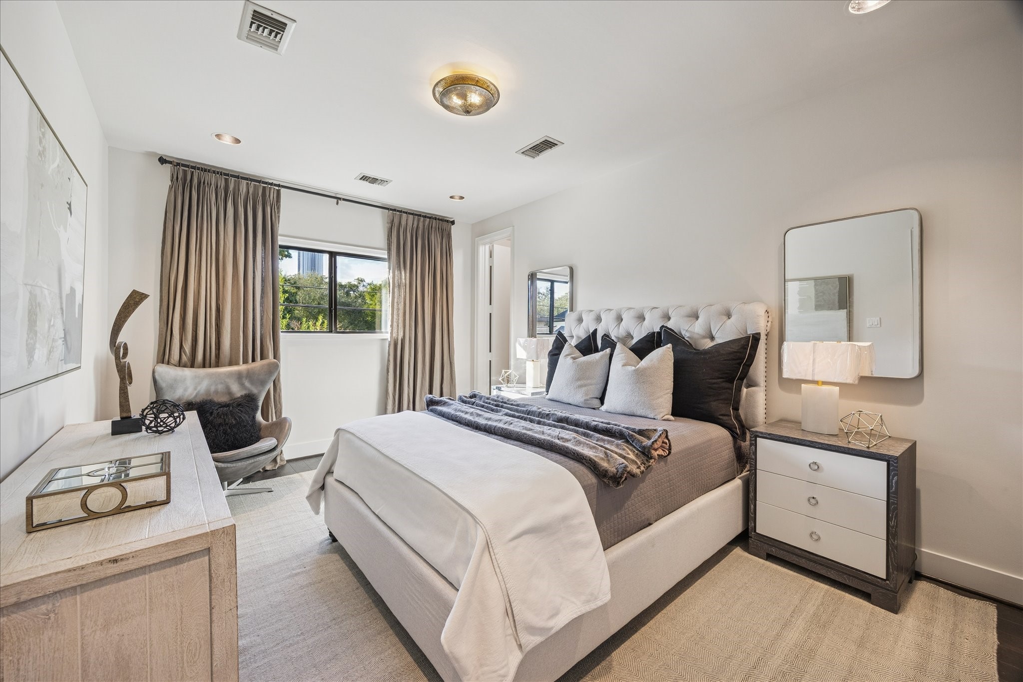 3124 Mid Lane Houston, TX 77027 - Photo 32 of 41 a bedroom with a bed and wooden floor