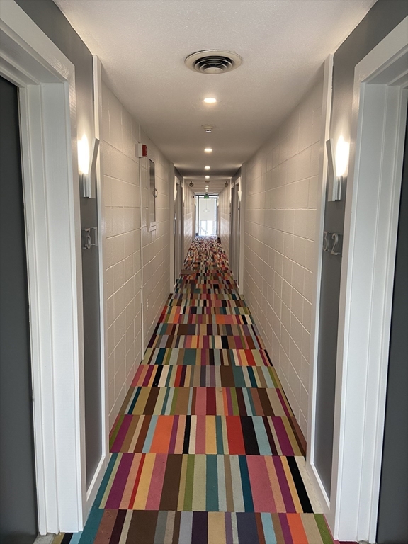 14 Murdock Street, Unit 28 Somerville, MA 02145 - Photo 11 of 14 a very nice looking room with wooden floor