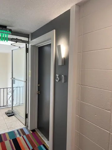 a bathroom with a mirror and a shower