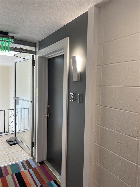 14 Murdock Street, Unit 28 Somerville, MA 02145 - Photo 13 of 14 a bathroom with a mirror and a shower