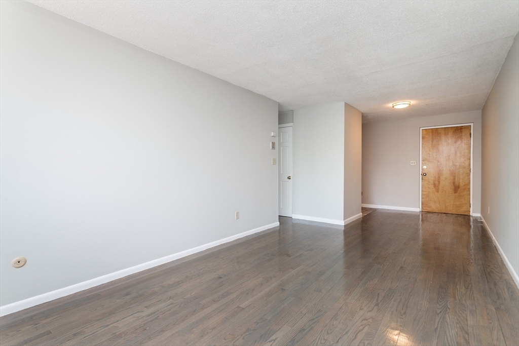 14 Murdock Street, Unit 28 Somerville, MA 02145 - Photo 5 of 14 a view of an empty room and wooden floor