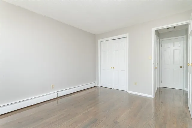 an empty room with wooden floor