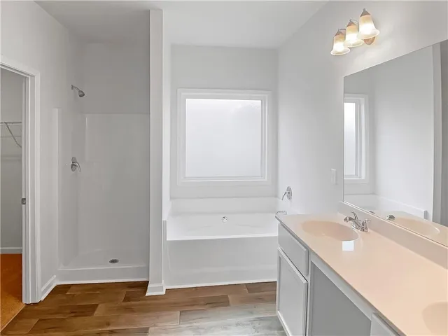 a bathroom with a bathtub and a sink