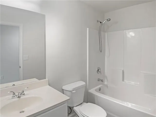 a bathroom with a sink toilet and bathtub