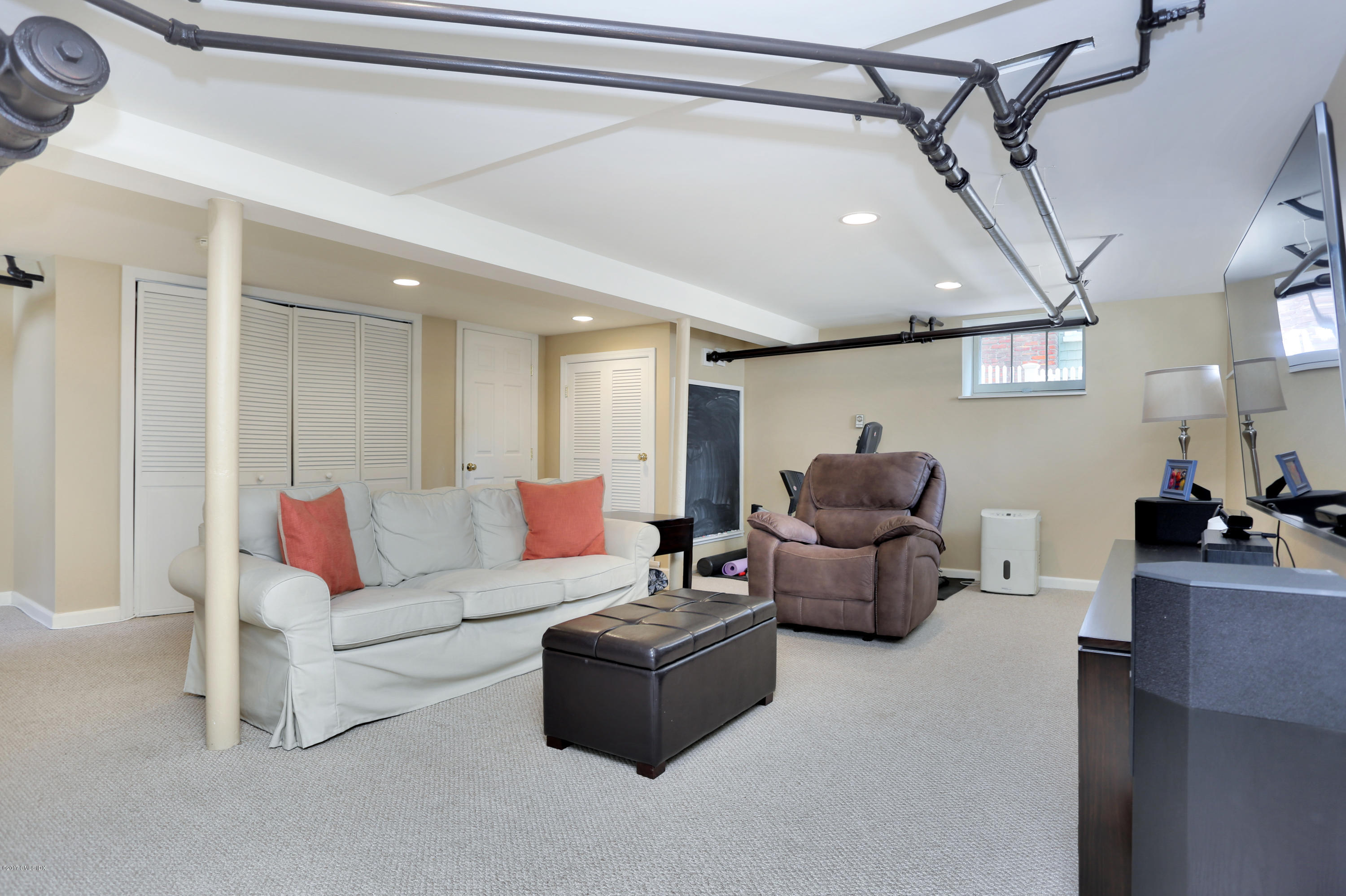 27 Pleasant Street Cos Cob, CT 06807 - Photo 11 of 21 a living room with furniture and a ceiling fan
