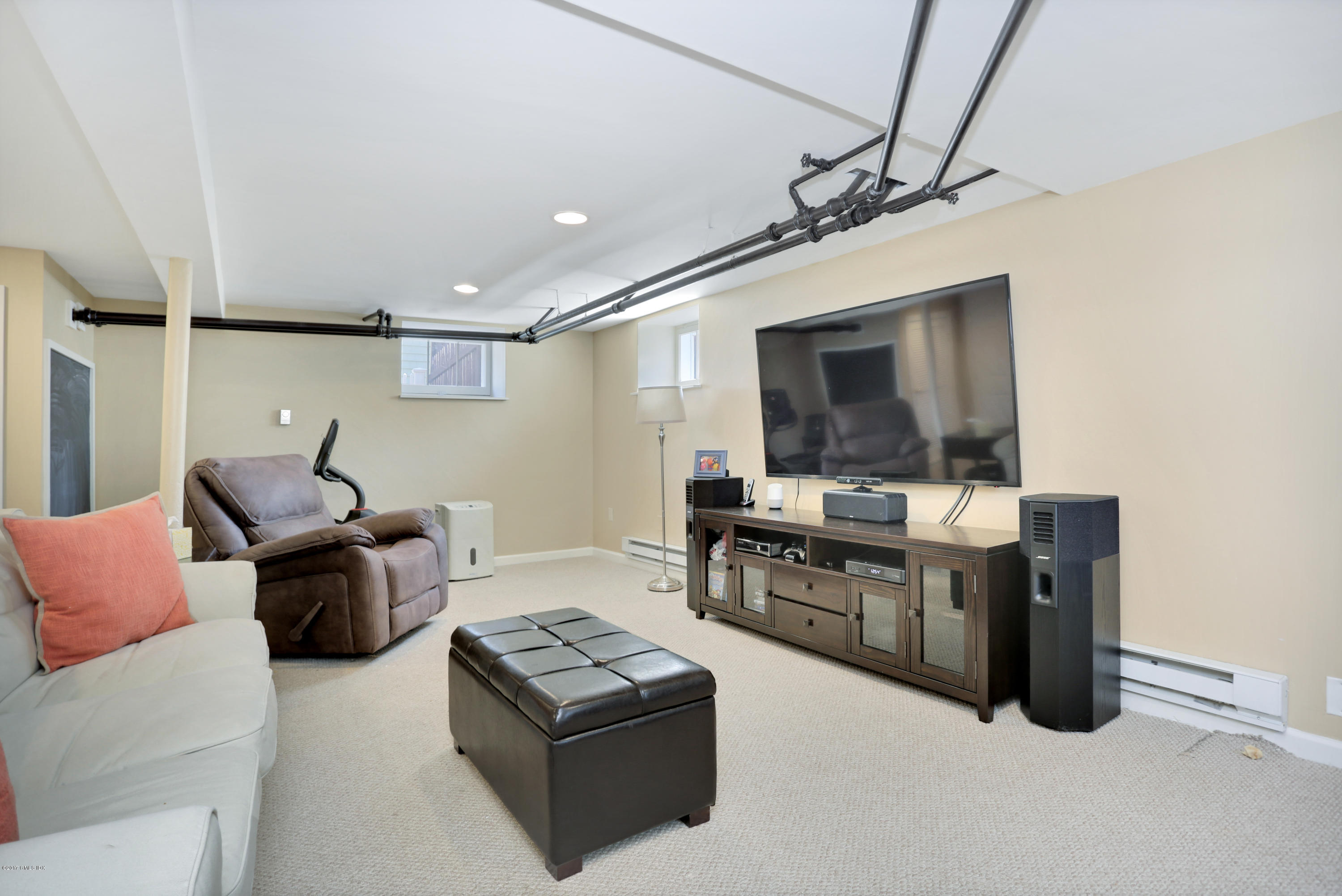 27 Pleasant Street Cos Cob, CT 06807 - Photo 12 of 21 a living room with furniture and a flat screen tv