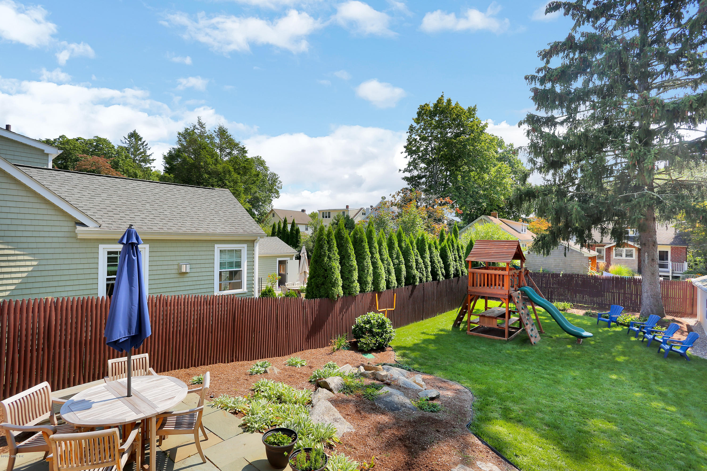 27 Pleasant Street Cos Cob, CT 06807 - Photo 16 of 21 a view of a chair and table in backyard of the house