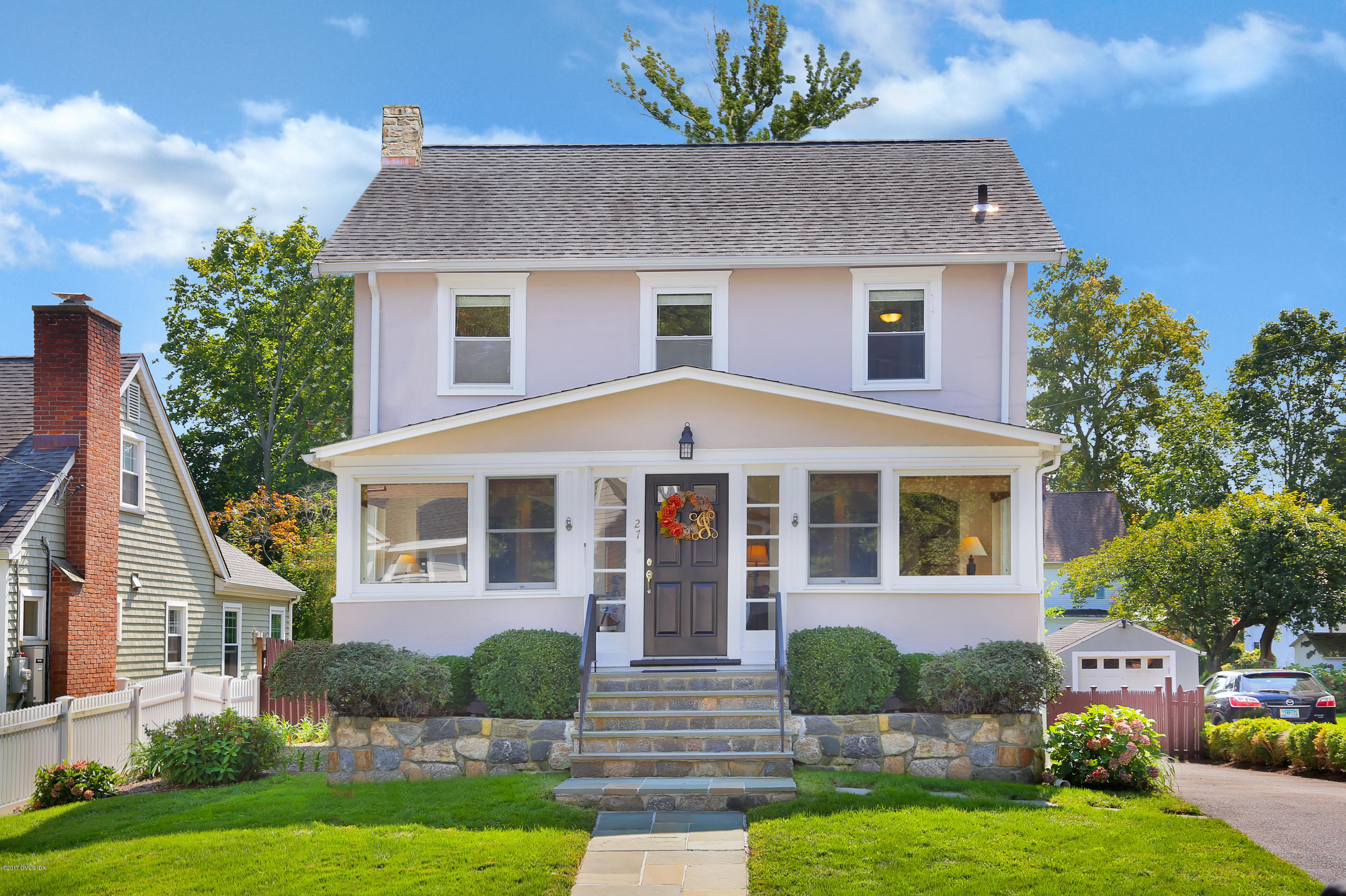 27 Pleasant Street Cos Cob, CT 06807 - Photo 21 of 21 a front view of a house with garden