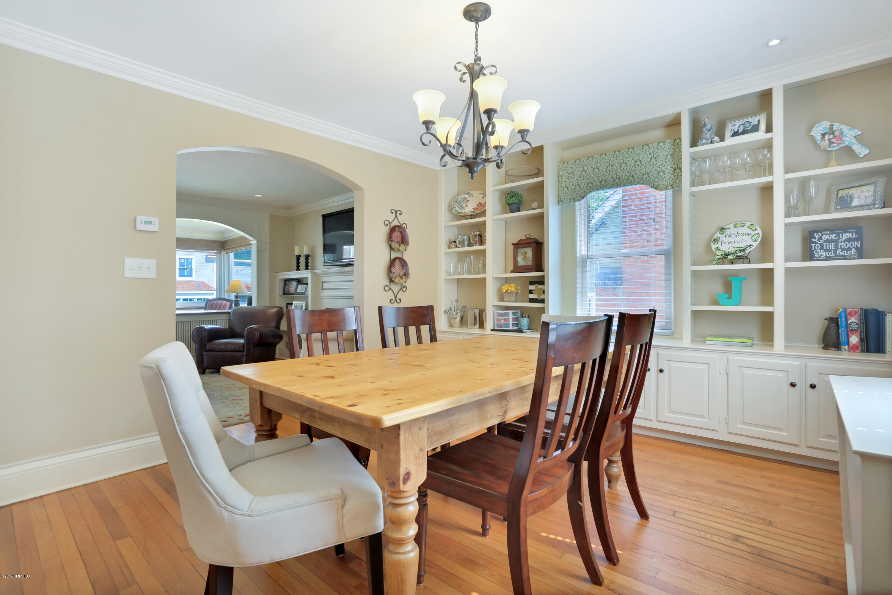 27 Pleasant Street Cos Cob, CT 06807 - Photo 7 of 21 a view of a dining room with furniture and wooden floor