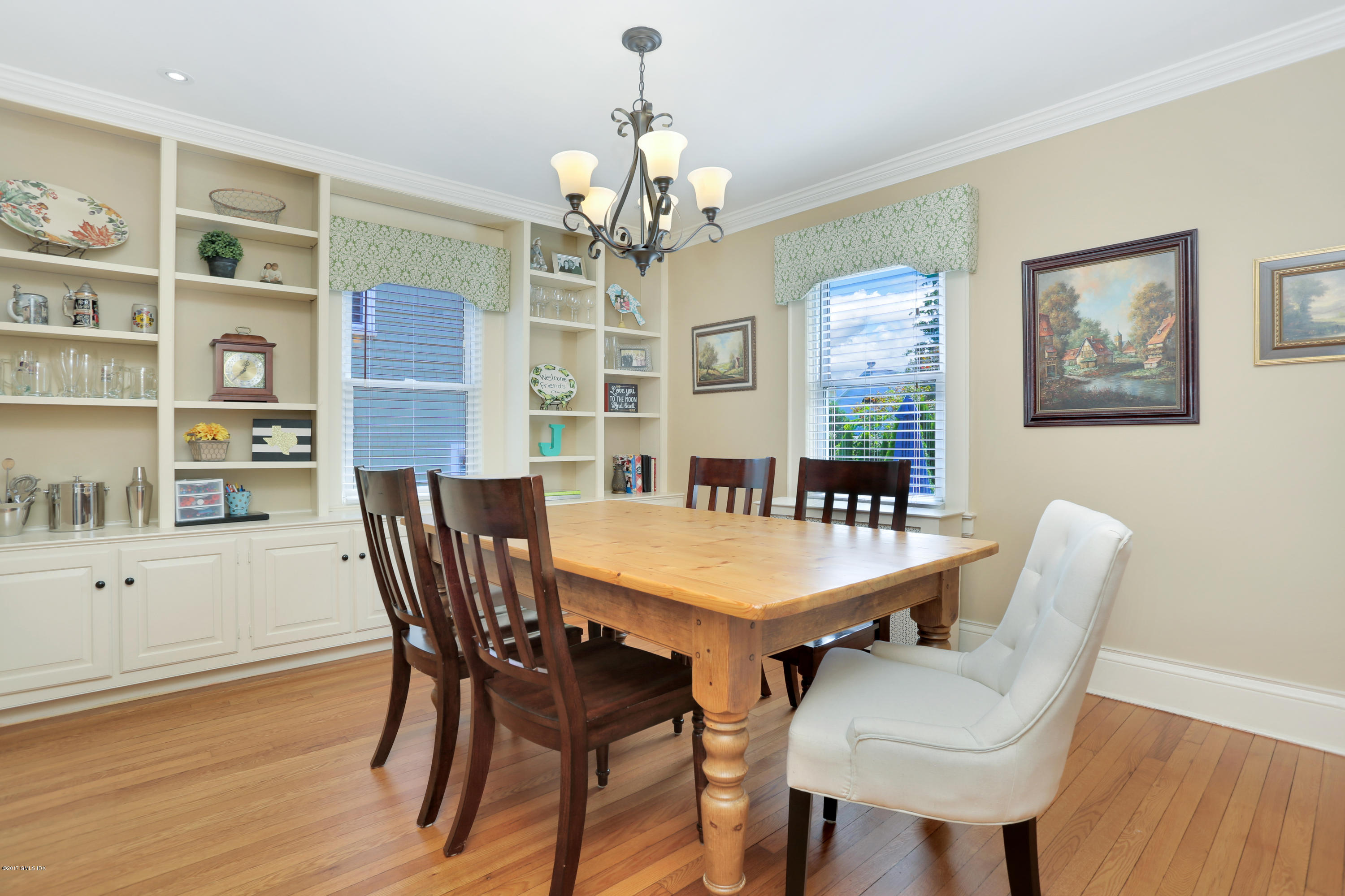 27 Pleasant Street Cos Cob, CT 06807 - Photo 8 of 21 a view of a dining room with furniture window and wooden floor