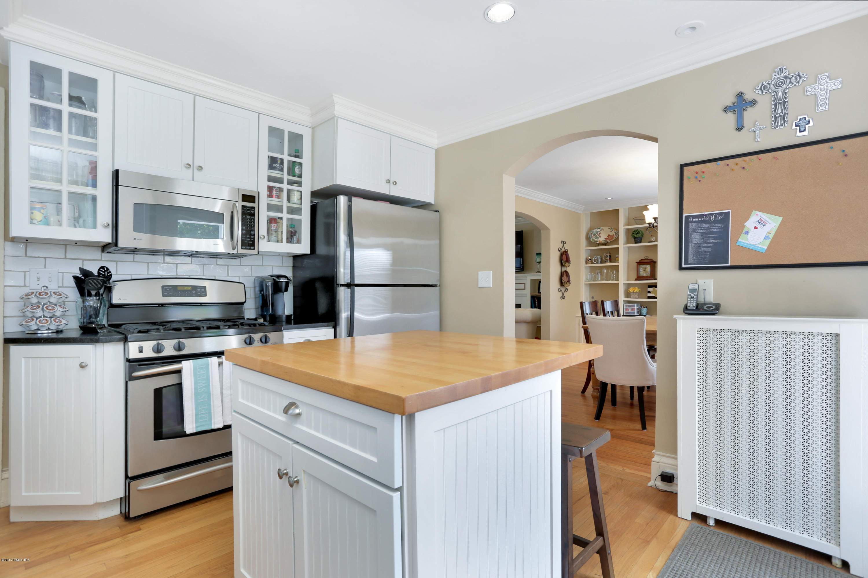 27 Pleasant Street Cos Cob, CT 06807 - Photo 10 of 21 a kitchen with stainless steel appliances granite countertop a refrigerator and a stove top oven