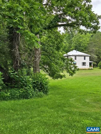 a backyard of a house with lots of green space