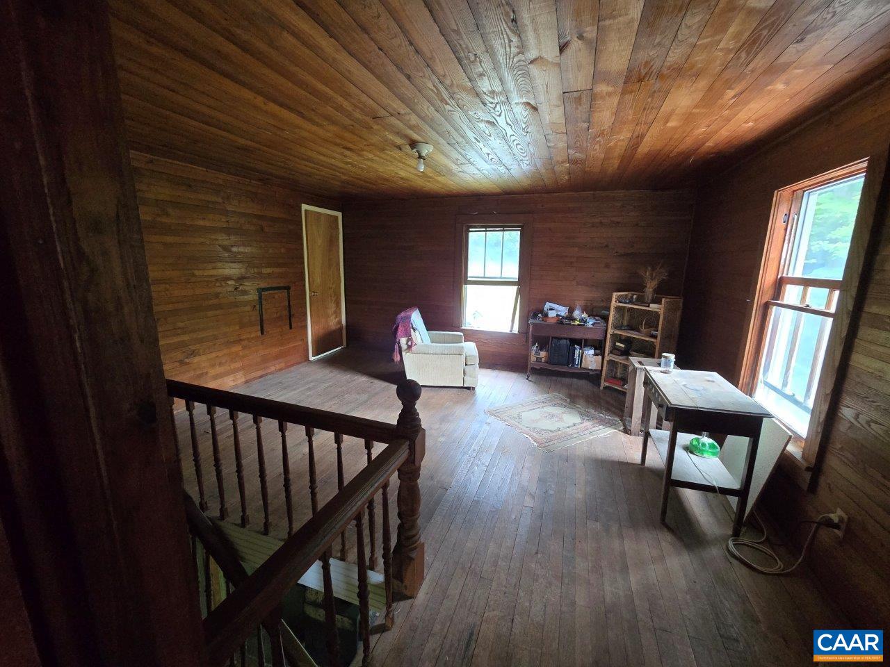 8947 Sugar Run Road Northeast Copper Hill, VA 24079 - Photo 3 of 28 a view of a livingroom with furniture window and wooden floor