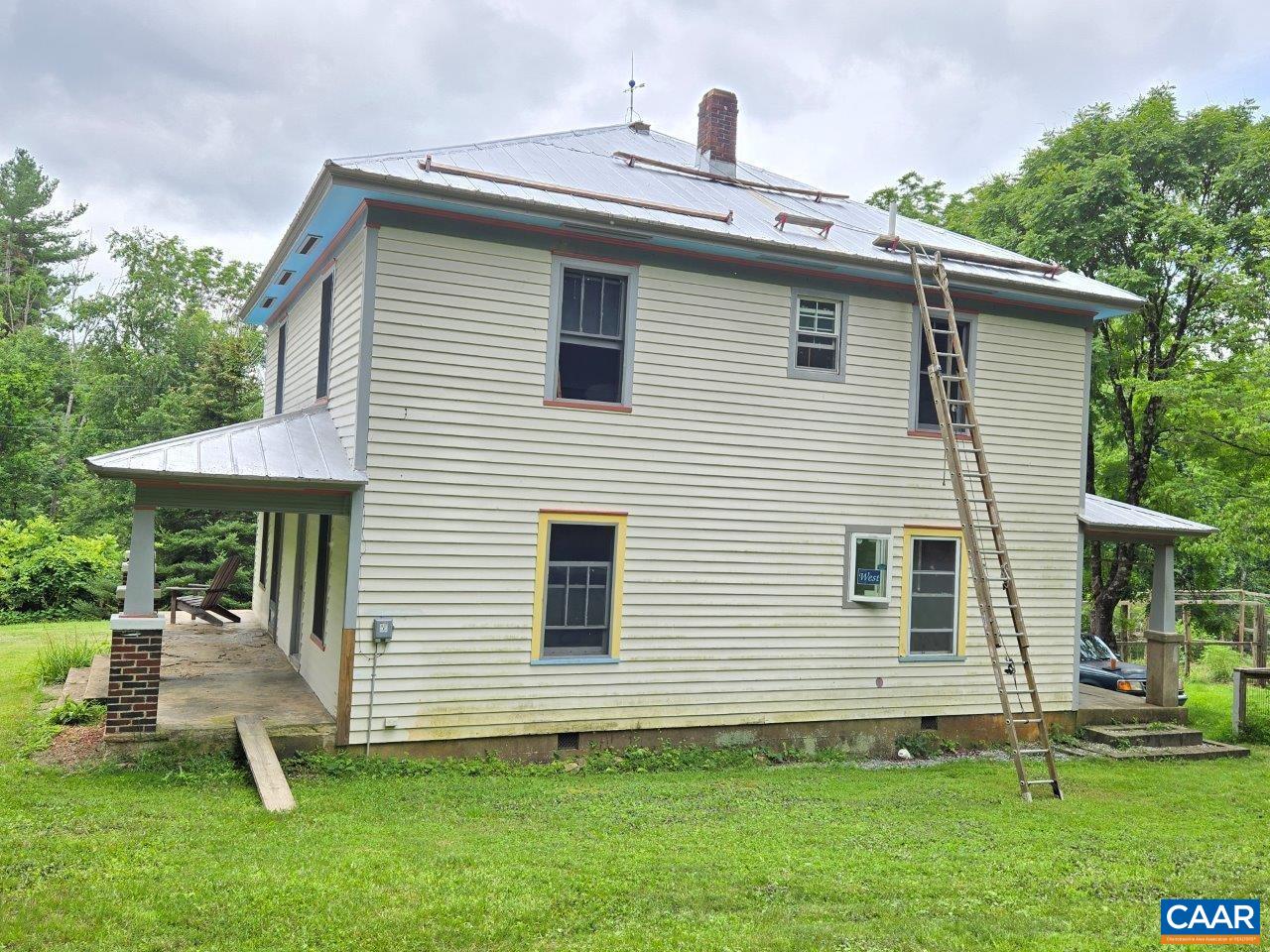 8947 Sugar Run Road Northeast Copper Hill, VA 24079 - Photo 5 of 28 a front view of a house with a yard