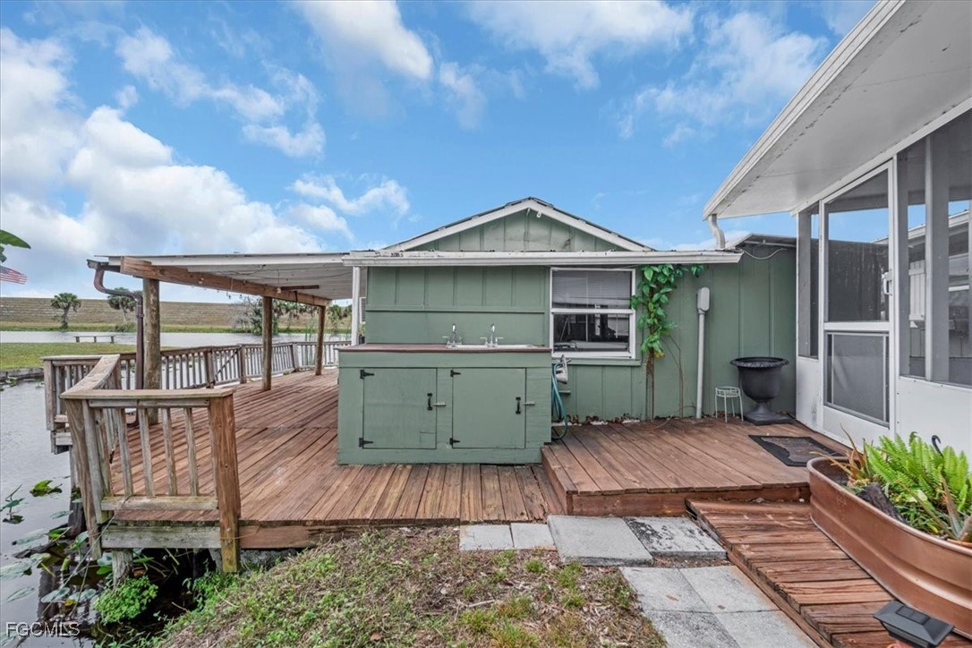 1083 Sunset Strip Moore Haven Okeechobee, FL 34974 - Photo 34 of 48 a view of a house with a yard