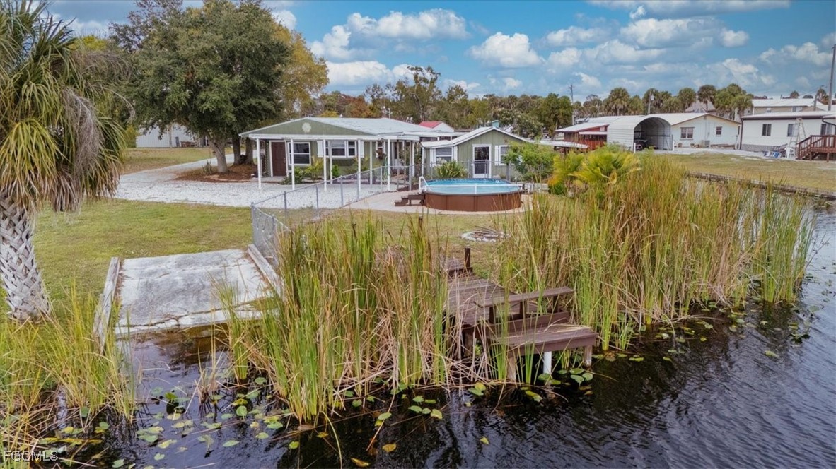 1083 Sunset Strip Moore Haven Okeechobee, FL 34974 - Photo 43 of 48 an aerial view of a house with a garden view