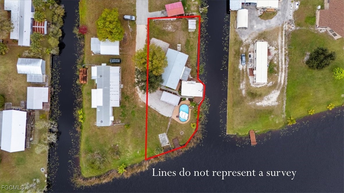 1083 Sunset Strip Moore Haven Okeechobee, FL 34974 - Photo 47 of 48 an aerial view of residential houses with outdoor space