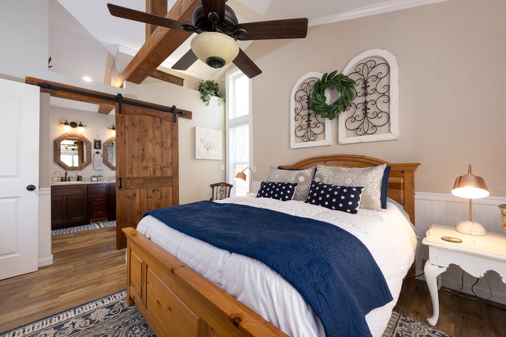 3301 Ellington Road Hayesville, NC 28904 - Photo 13 of 31 a bedroom with a bed and a chandelier