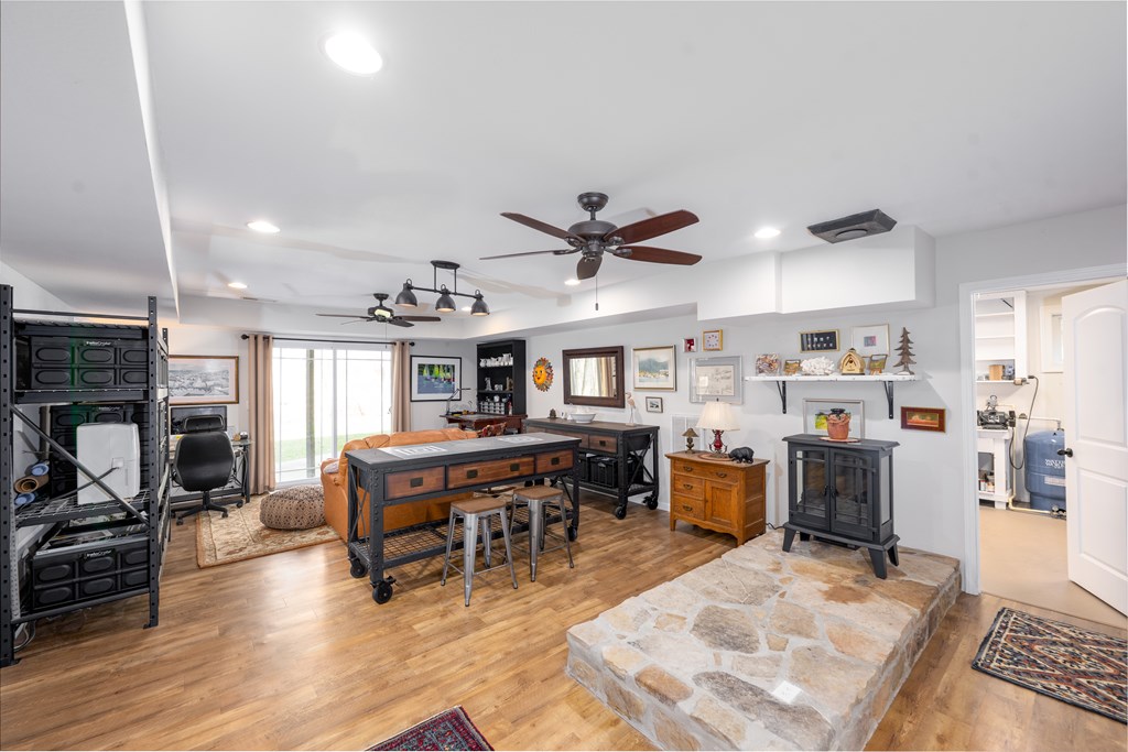 3301 Ellington Road Hayesville, NC 28904 - Photo 15 of 31 a living room with furniture a dining table and kitchen view with wooden floor