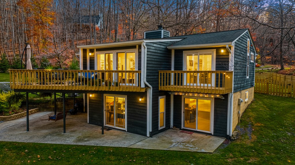 3301 Ellington Road Hayesville, NC 28904 - Photo 2 of 31 a view of a house with brick walls and a yard with plants
