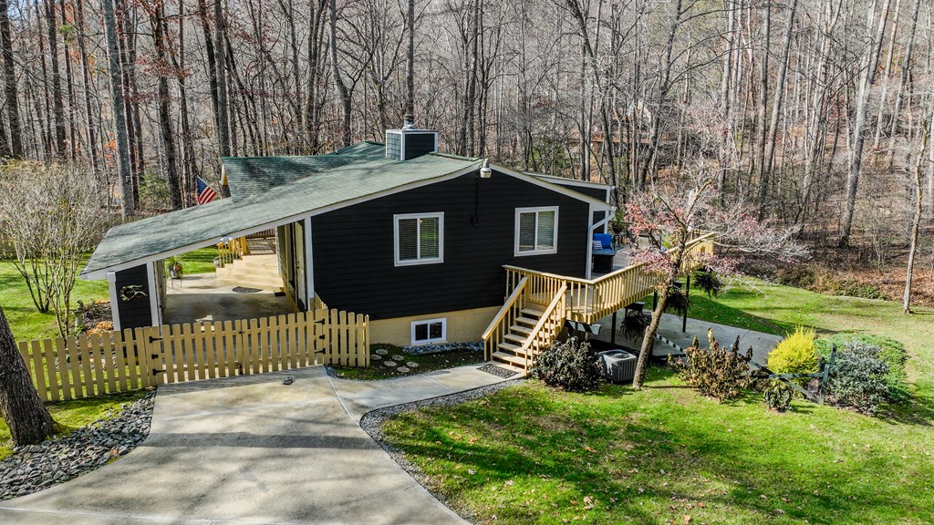 3301 Ellington Road Hayesville, NC 28904 - Photo 24 of 31 a view of a chair and table in backyard of the house