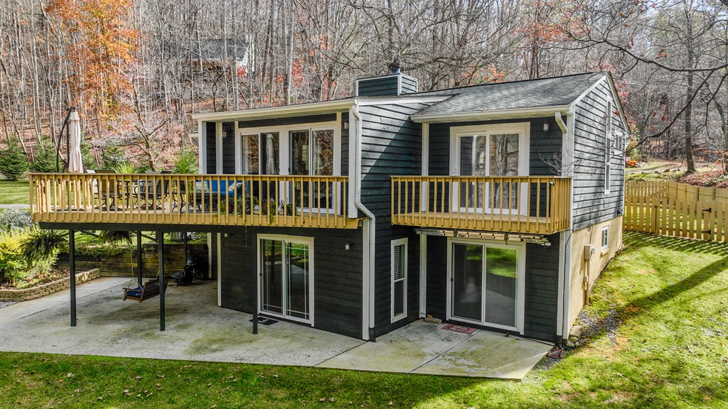 3301 Ellington Road Hayesville, NC 28904 - Photo 27 of 31 a view of a house with a yard balcony and swing