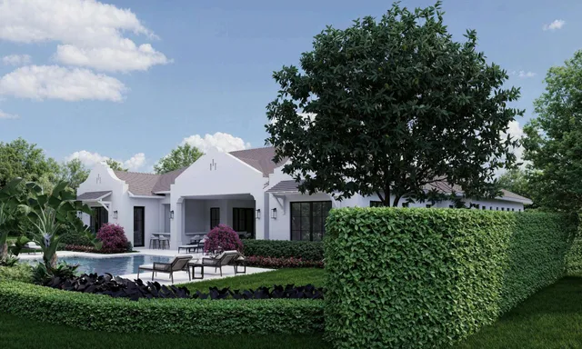 a front view of a house with a garden