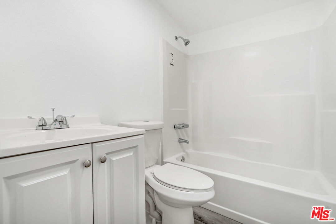 5351 Odell Street Riverside, CA 92509 - Photo 6 of 10 a bathroom with a sink a toilet and shower