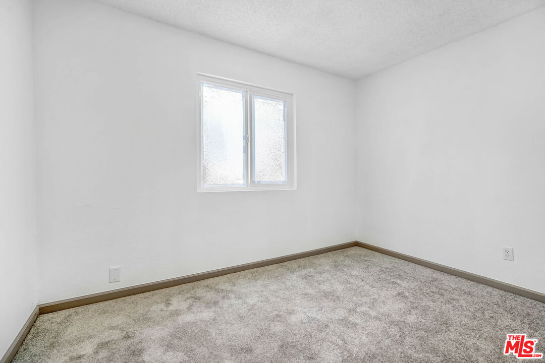 5351 Odell Street Riverside, CA 92509 - Photo 7 of 10 an empty room with a window