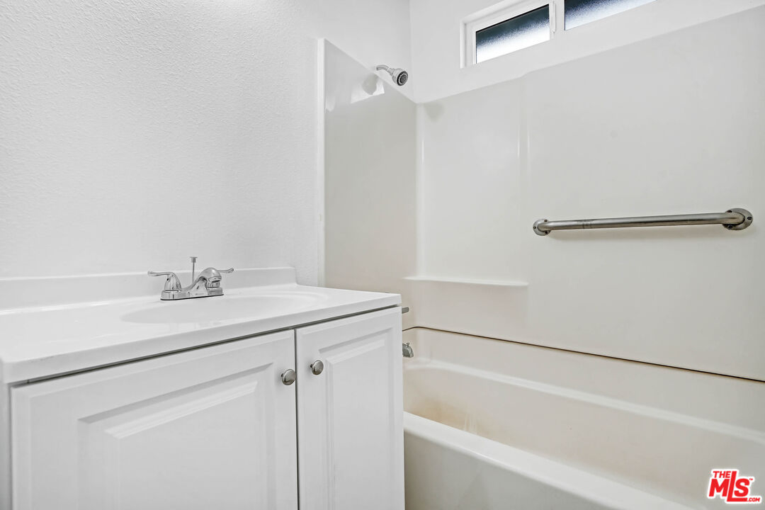 5351 Odell Street Riverside, CA 92509 - Photo 9 of 10 a bathroom with a sink and a bathtub