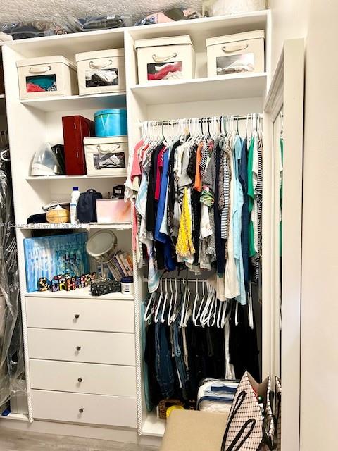 16110 Southwest 6th Street Pembroke Pines, FL 33027 - Photo 28 of 92 a view of walk in closet with clothes and shoes