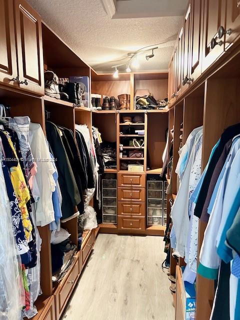 16110 Southwest 6th Street Pembroke Pines, FL 33027 - Photo 33 of 92 a view of walk in closet with clothes and shoes