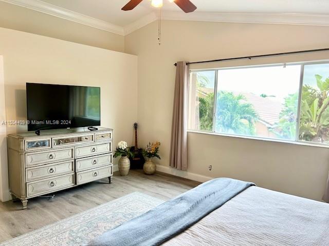 16110 Southwest 6th Street Pembroke Pines, FL 33027 - Photo 35 of 92 a bedroom with a bed and flat screen tv