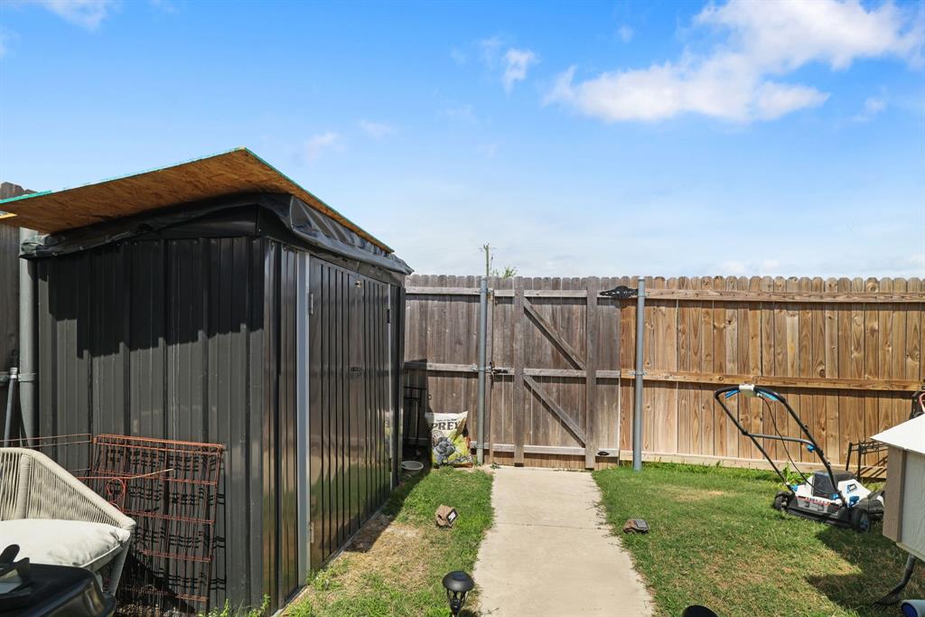 1445 Sterling Way Ferris, TX 75125 - Photo 16 of 17 Fenced yard with a gate