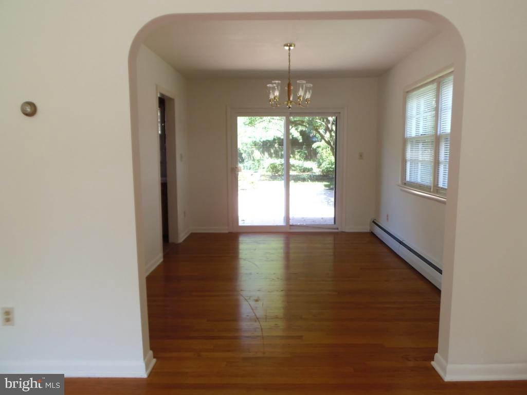 1714 Sammar Road Lancaster, PA 17601 - Photo 3 of 35 a view of an empty room with wooden floor and a window