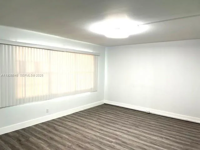 a view of a backyard with swimming pool