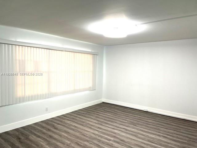 13455 Southwest 9th Court, Unit 216J Pembroke Pines, FL 33027 - Photo 15 of 66 wooden floor in an empty room with a window
