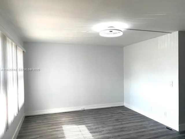 a view of a wooden deck and a yard