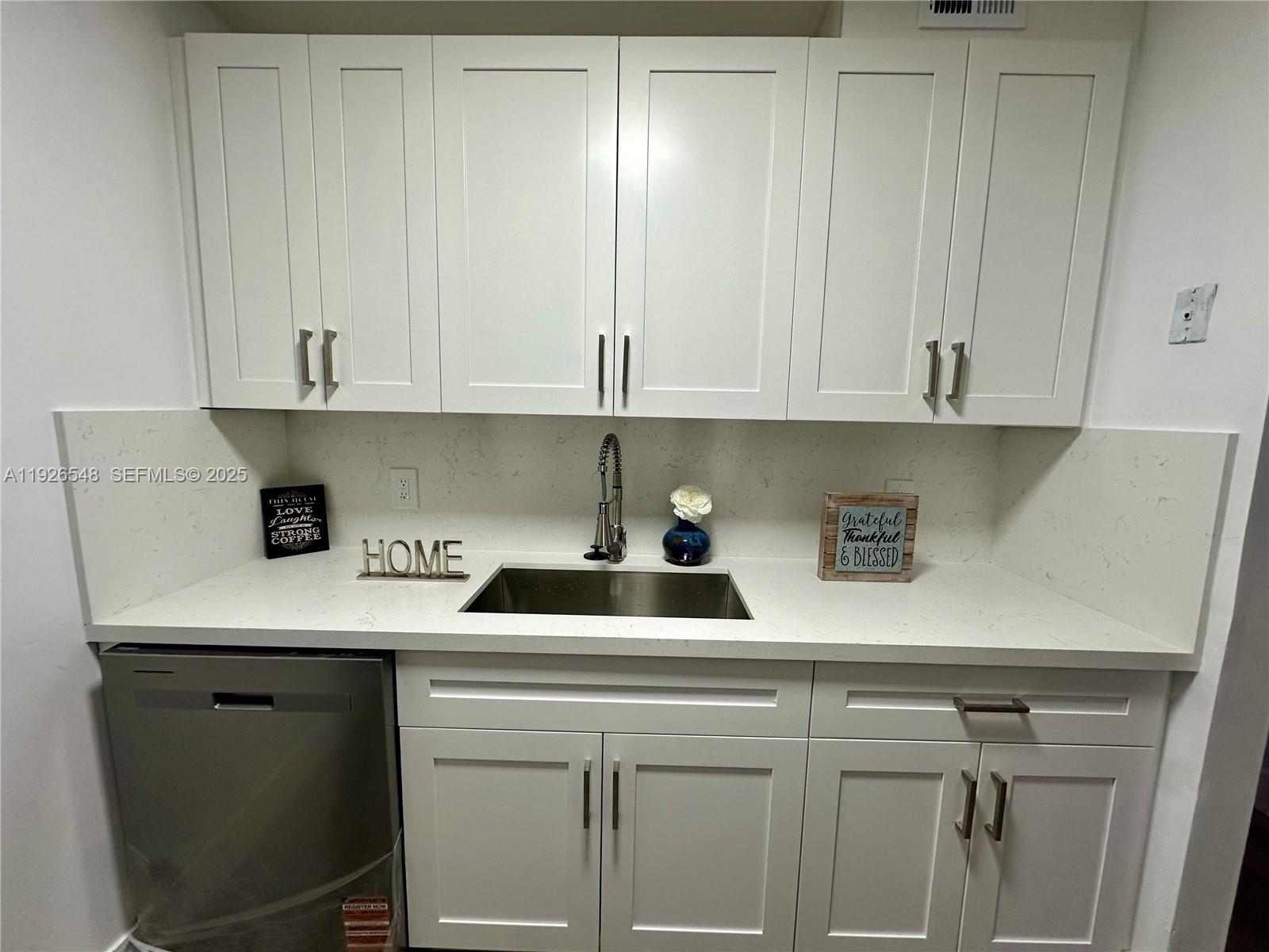 13455 Southwest 9th Court, Unit 216J Pembroke Pines, FL 33027 - Photo 3 of 66 a kitchen with stainless steel appliances granite countertop a sink a stove and cabinets