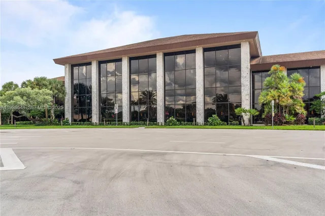 a sign on the side of the grass