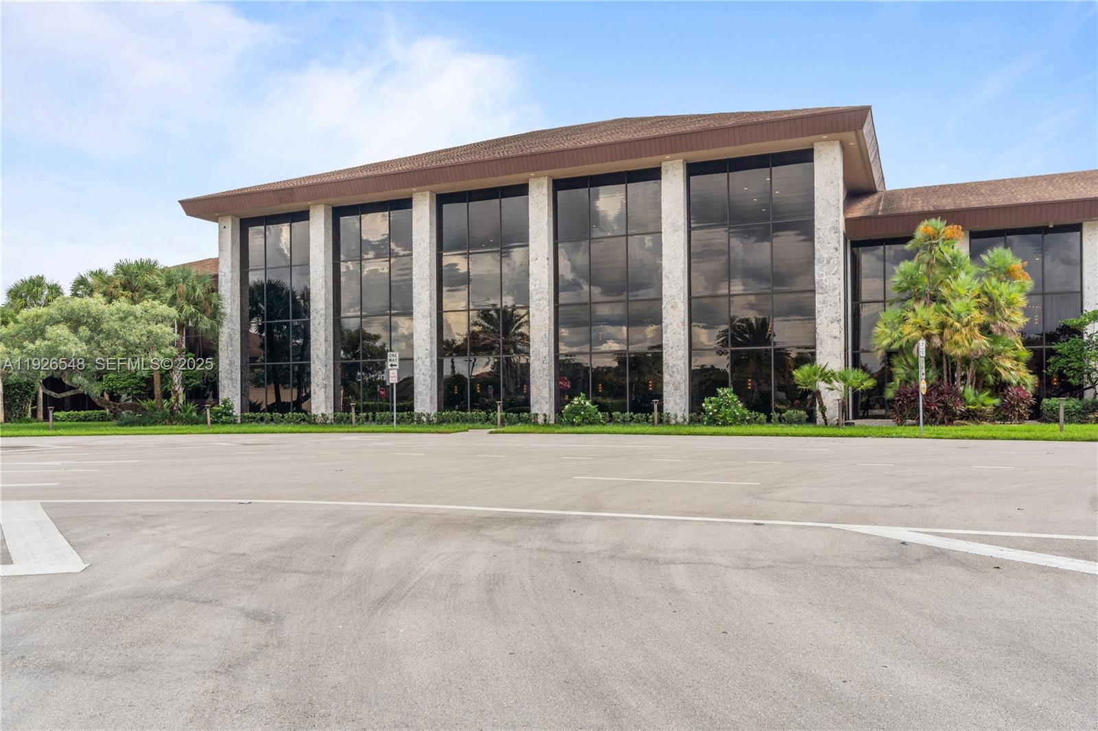 13455 Southwest 9th Court, Unit 216J Pembroke Pines, FL 33027 - Photo 35 of 66 a view of a brick house with a garden