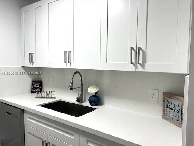 a kitchen with a sink and a cabinets